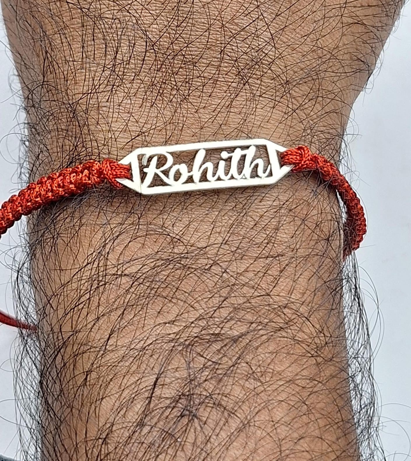 customized silver rakhi with name